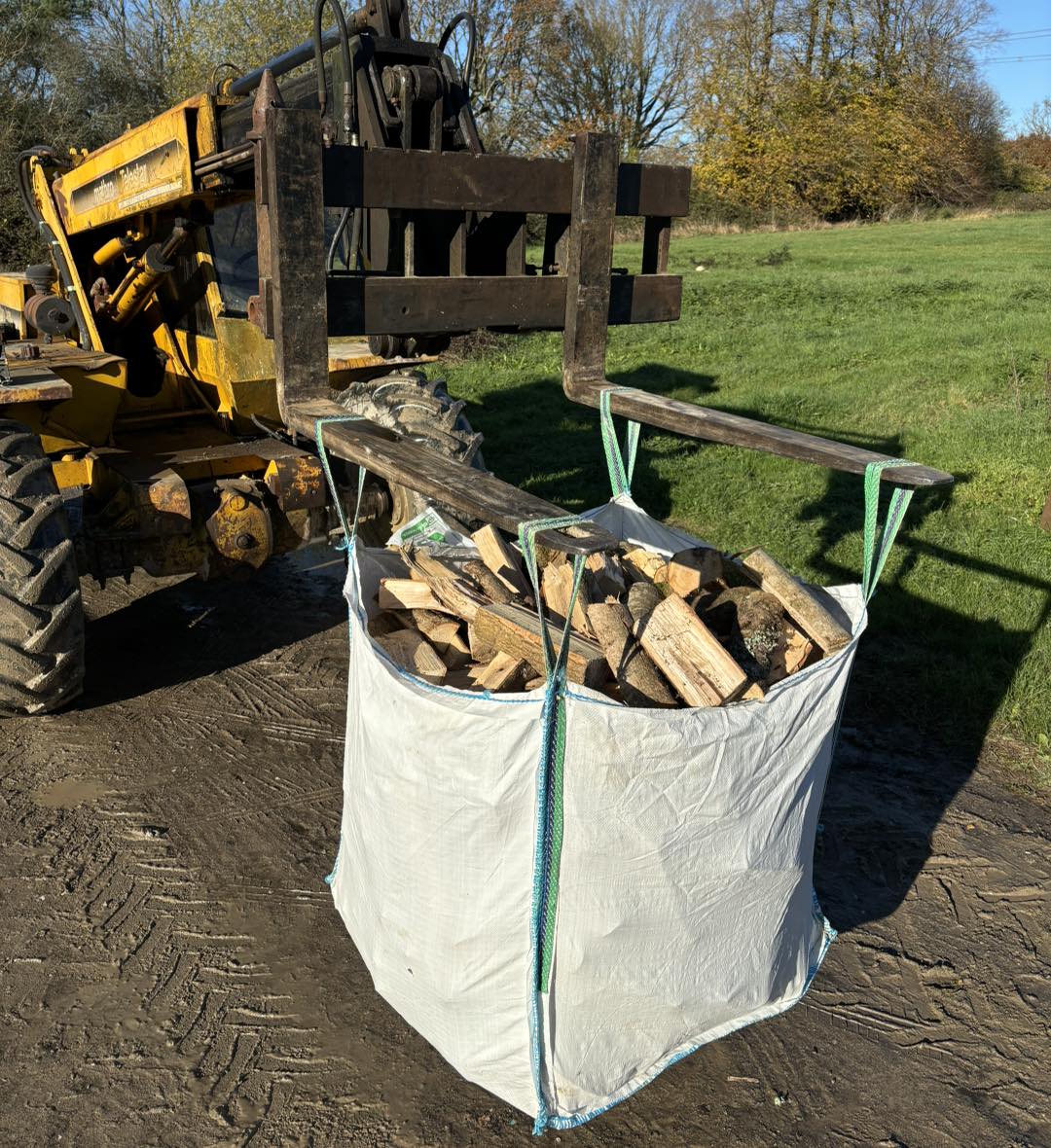 A tonne bag of split seasoned hardwood lifted by a forklift